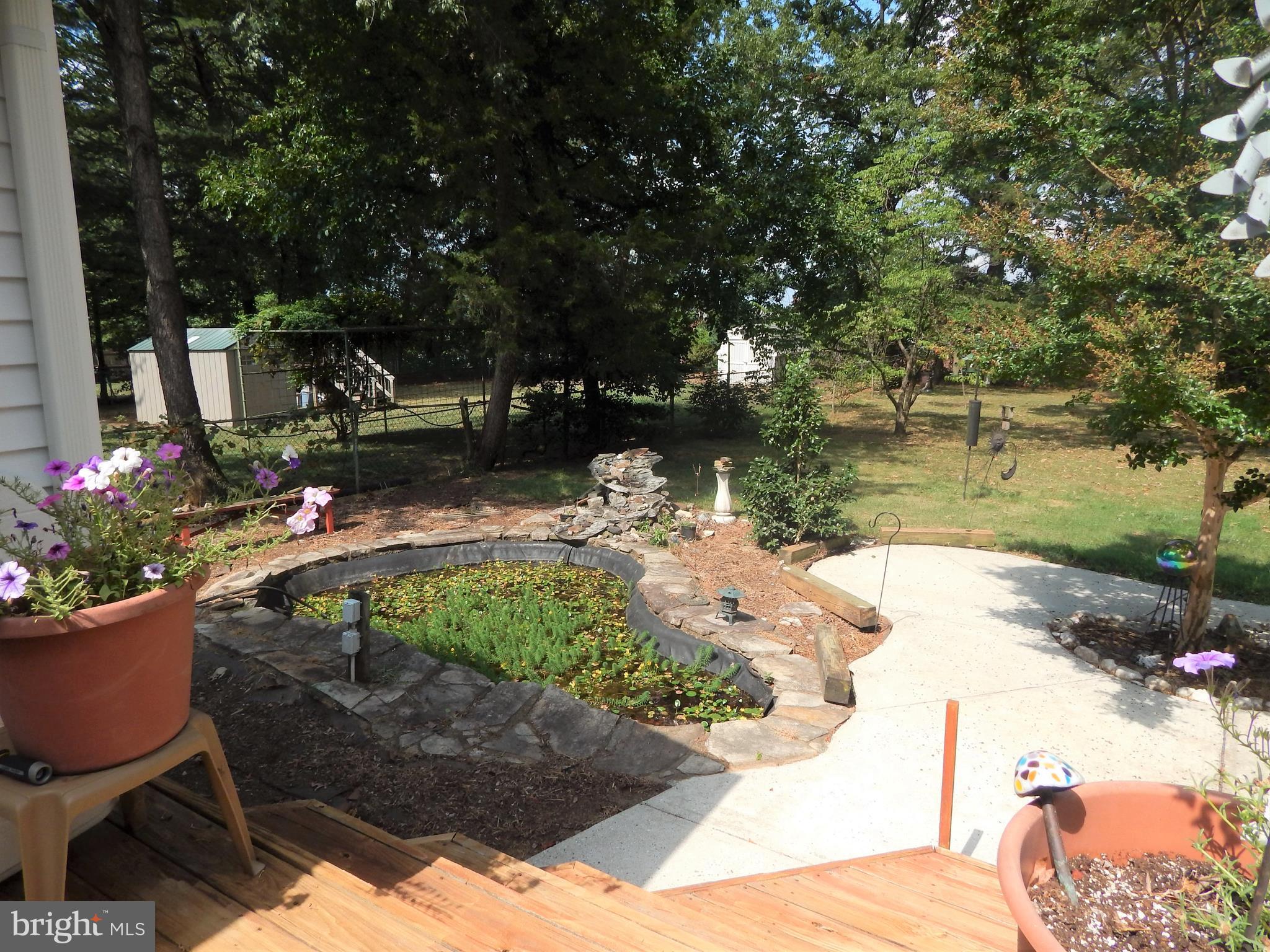 7314 Castlemoor Road Baltimore, MD 21244 - Photo 35 of 39 Fish Pond with Waterfall