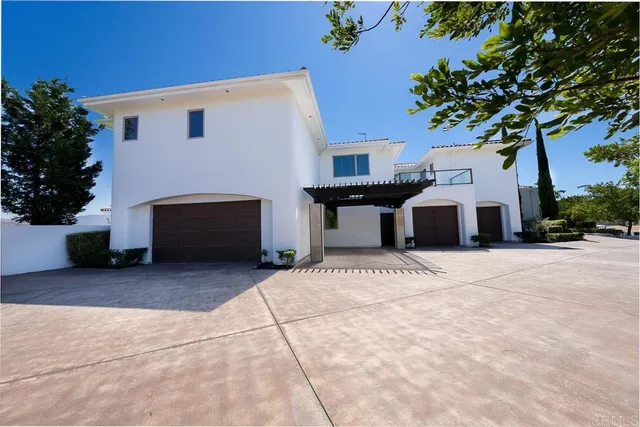 a view of an house with backyard space and a window