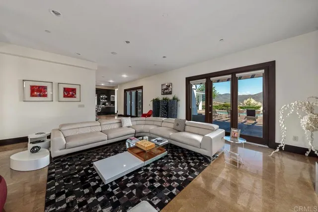 a living room with furniture rug and window
