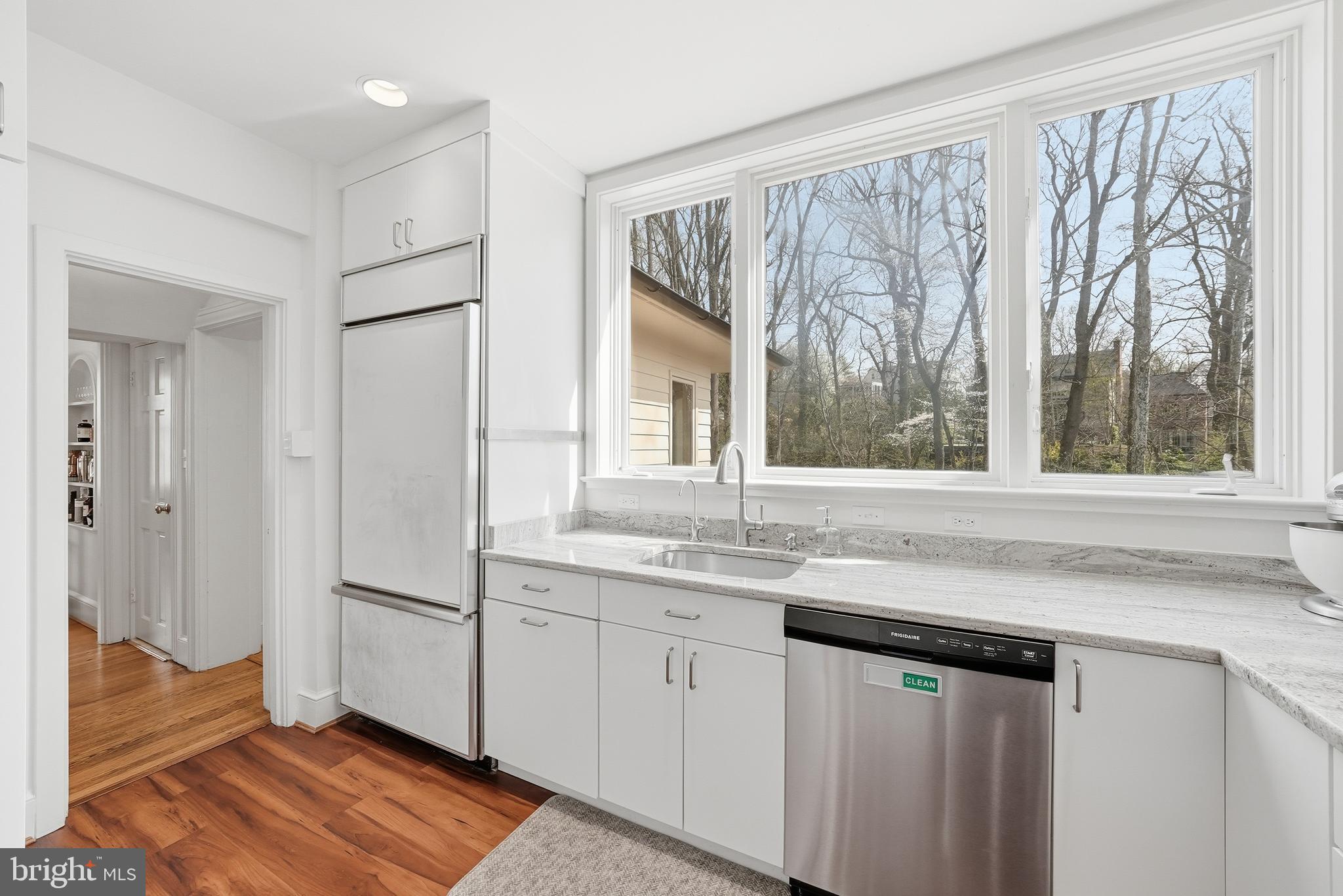 4938 Quebec Street Northwest Washington, DC 20016 - Photo 16 of 51 a kitchen with a sink and large window