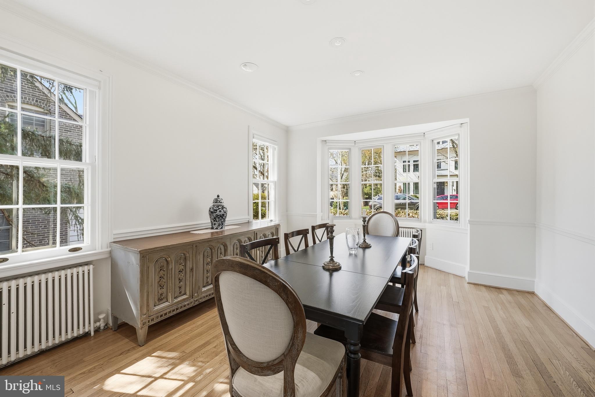 4938 Quebec Street Northwest Washington, DC 20016 - Photo 17 of 51 a dining room with furniture window and wooden floor