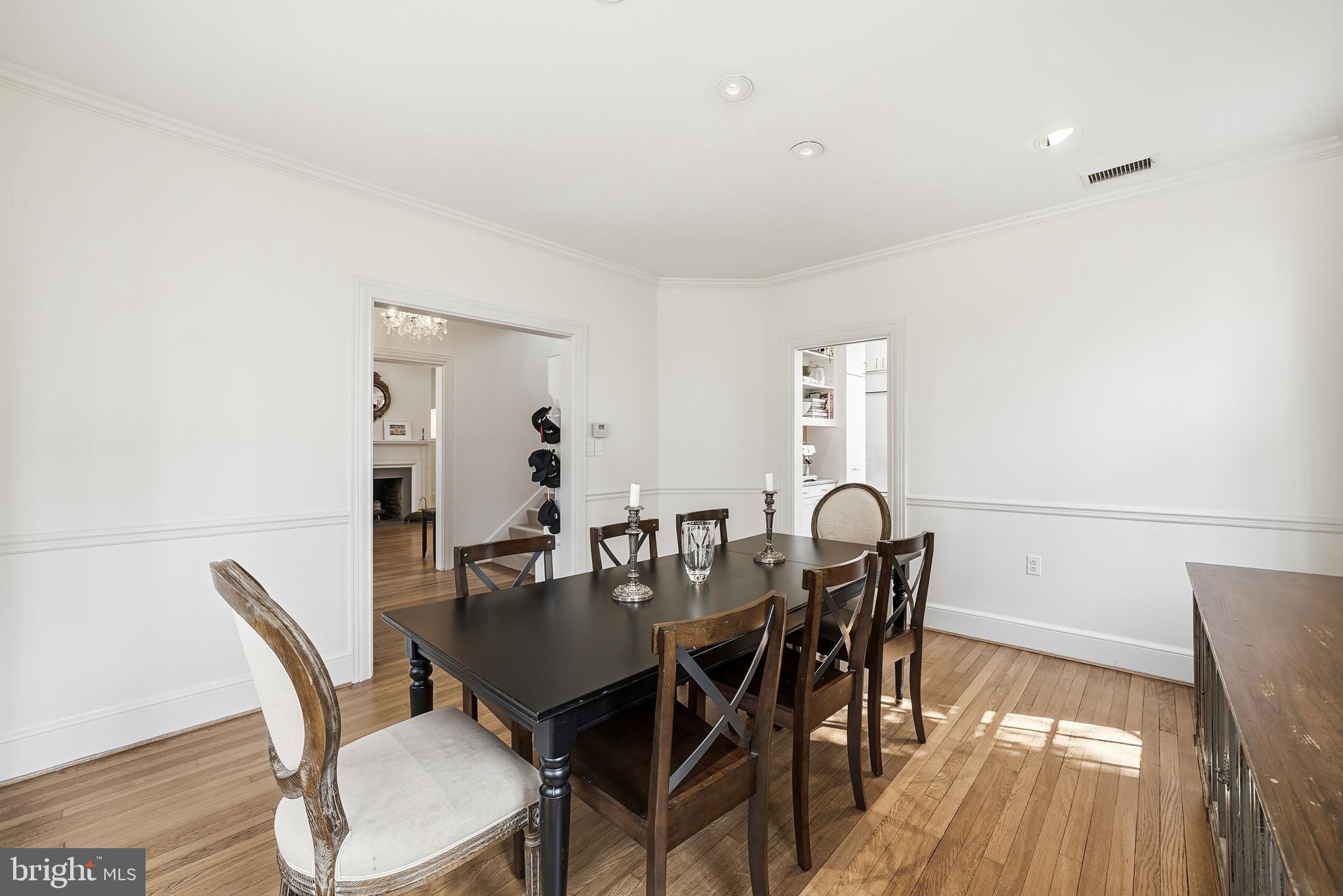 4938 Quebec Street Northwest Washington, DC 20016 - Photo 18 of 51 a dining room with furniture and wooden floor