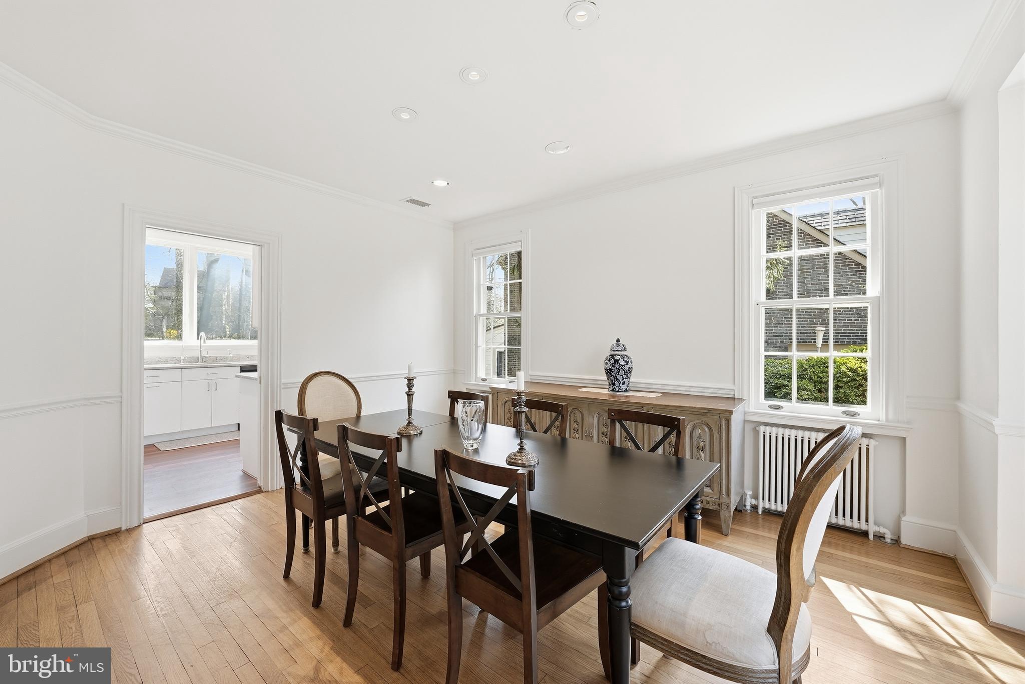 4938 Quebec Street Northwest Washington, DC 20016 - Photo 19 of 51 a view of a dining room with a table and chairs