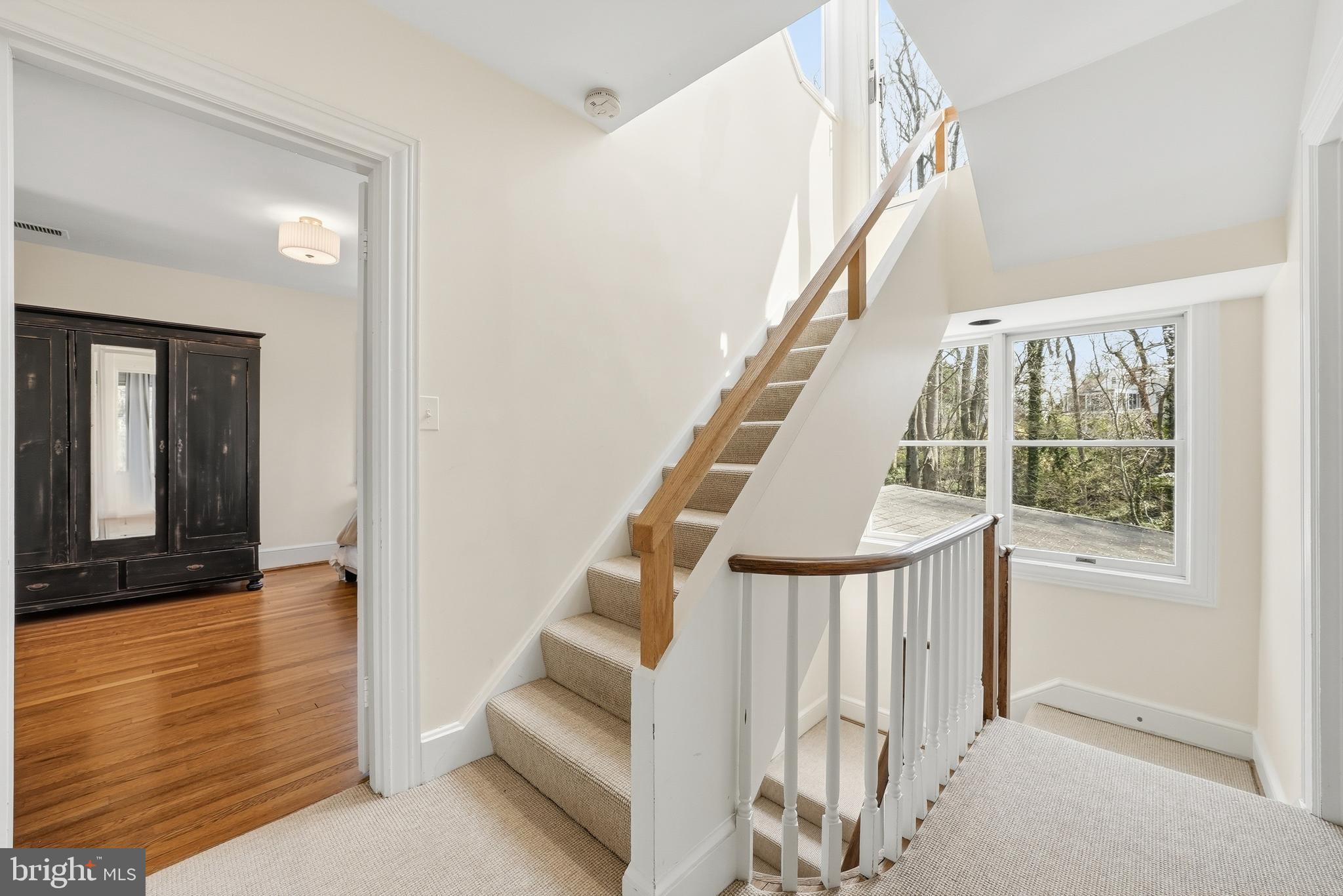 4938 Quebec Street Northwest Washington, DC 20016 - Photo 21 of 51 a view of staircase with white walls and a window