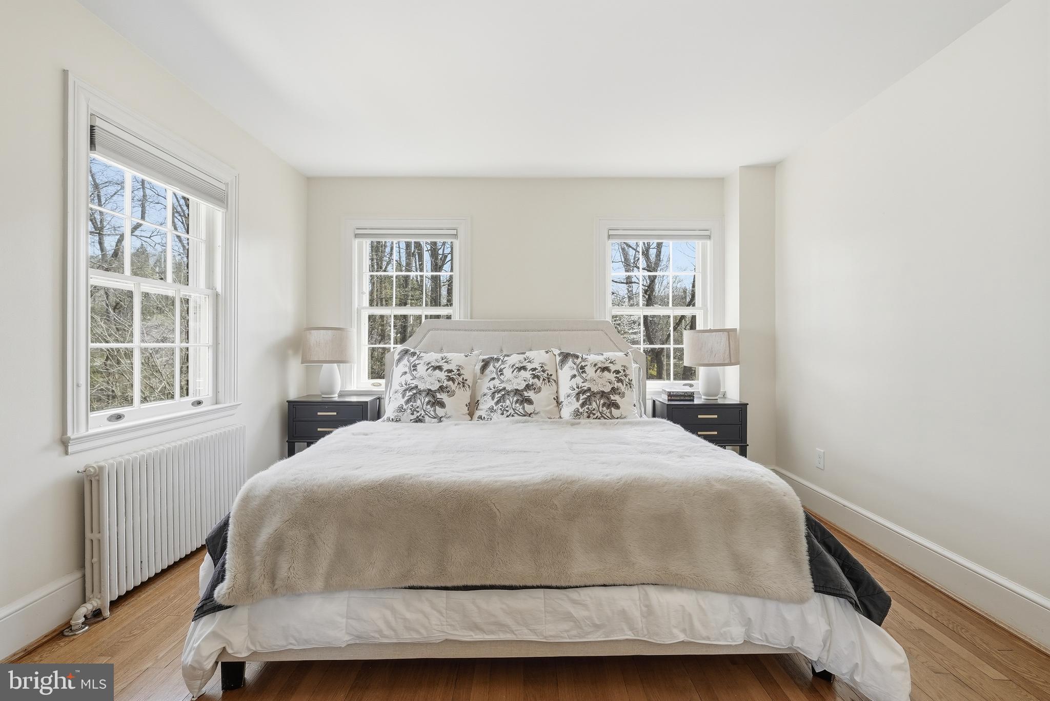 4938 Quebec Street Northwest Washington, DC 20016 - Photo 23 of 51 a bedroom with a large bed and a window