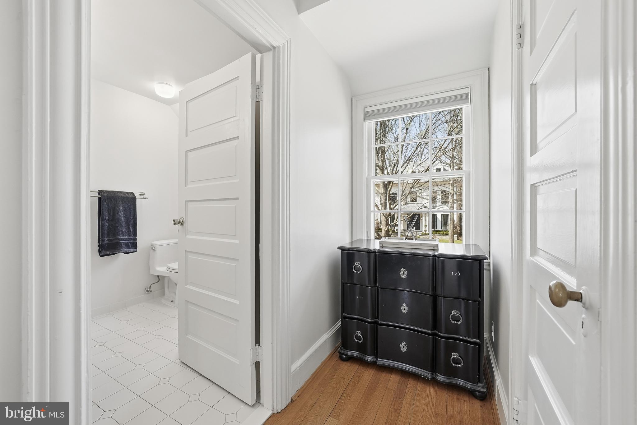 4938 Quebec Street Northwest Washington, DC 20016 - Photo 25 of 51 a bathroom with a sink a toilet and a shower