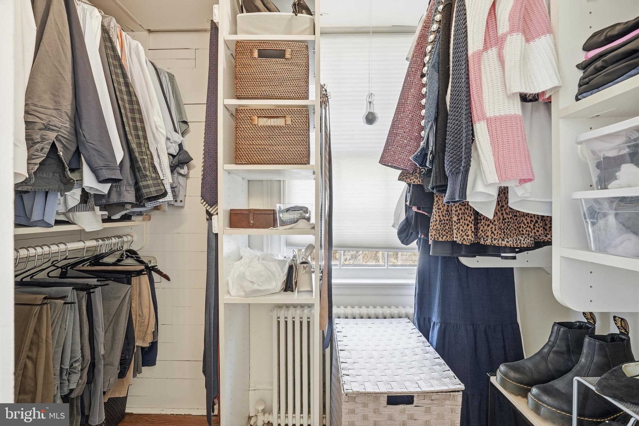 4938 Quebec Street Northwest Washington, DC 20016 - Photo 28 of 51 a view of walk in closet with clothes and shoes
