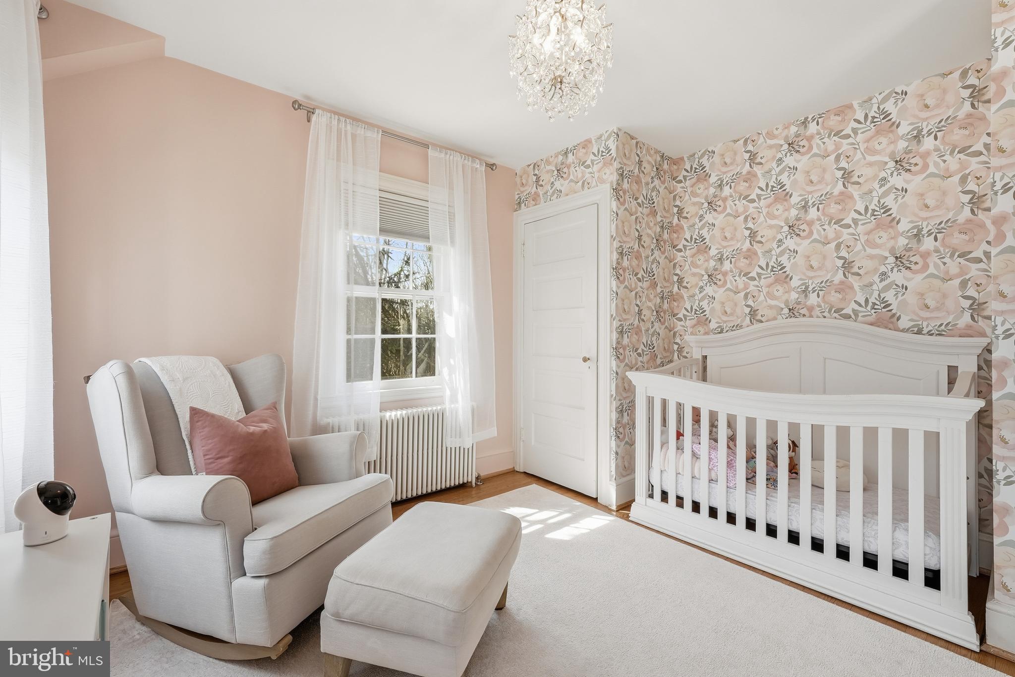 4938 Quebec Street Northwest Washington, DC 20016 - Photo 30 of 51 a living room with furniture and a window