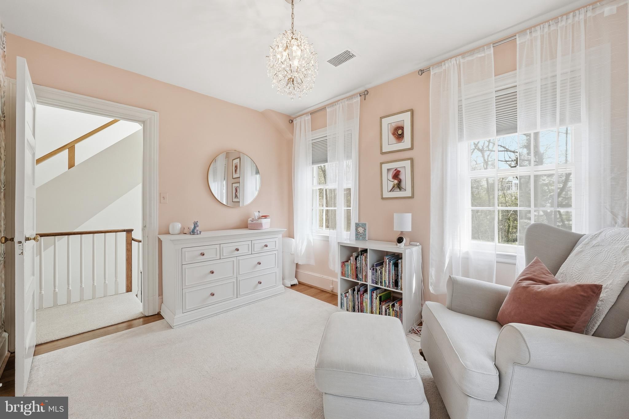 4938 Quebec Street Northwest Washington, DC 20016 - Photo 31 of 51 a living room with furniture a large window and a chandelier