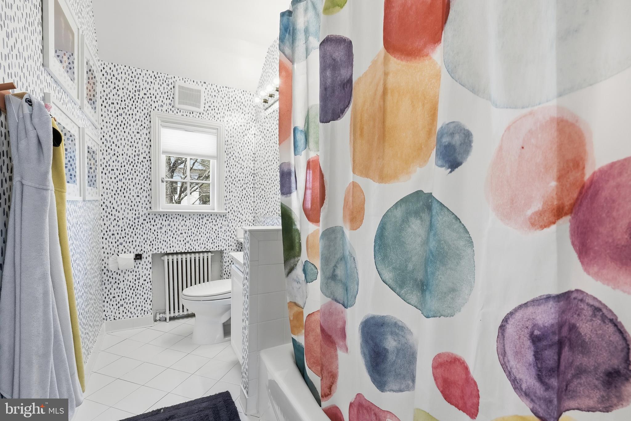 4938 Quebec Street Northwest Washington, DC 20016 - Photo 34 of 51 a bathroom with a sink toilet and mirror