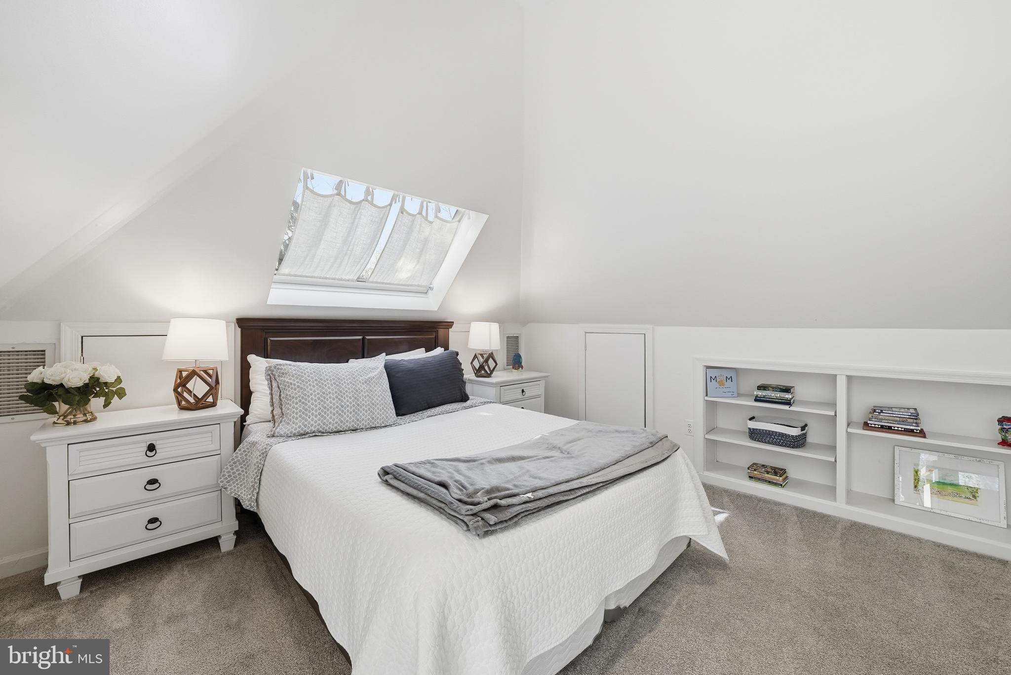 4938 Quebec Street Northwest Washington, DC 20016 - Photo 36 of 51 a bedroom with a bed and a cabinets