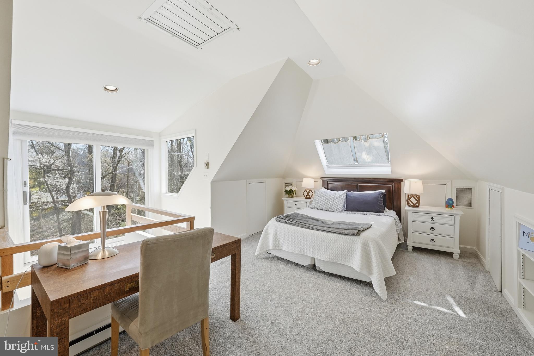 4938 Quebec Street Northwest Washington, DC 20016 - Photo 37 of 51 a bedroom with bed and a large window