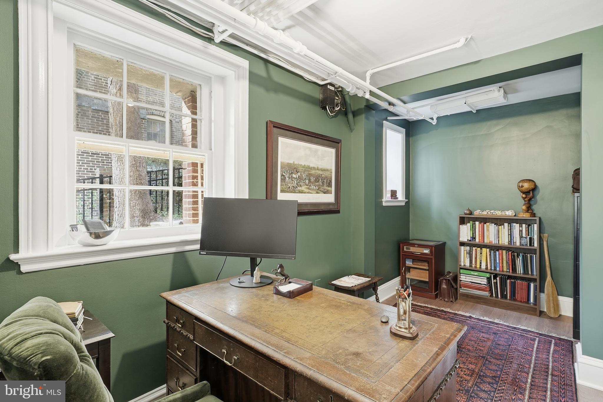 4938 Quebec Street Northwest Washington, DC 20016 - Photo 44 of 51 a view of a workspace with furniture