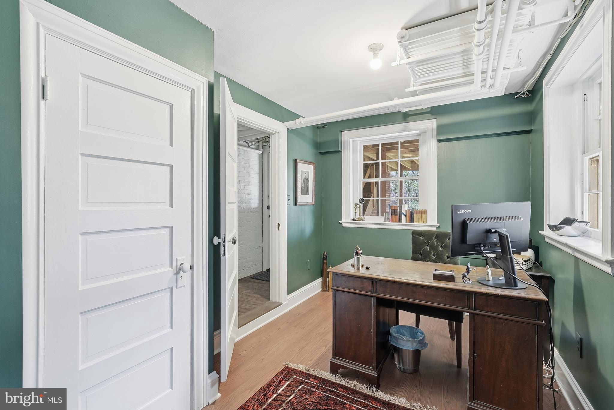 4938 Quebec Street Northwest Washington, DC 20016 - Photo 45 of 51 a workspace with furniture and window