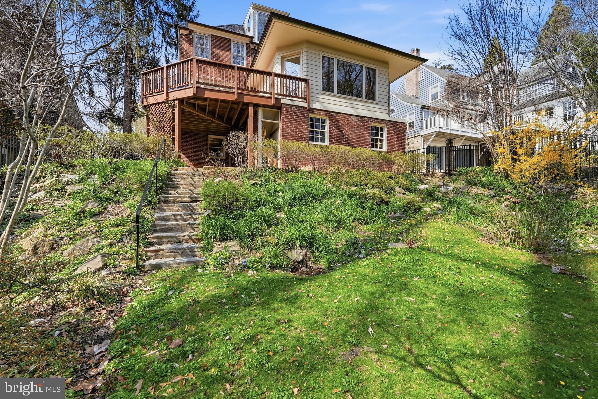 4938 Quebec Street Northwest Washington, DC 20016 - Photo 50 of 51 a view of a building with a yard