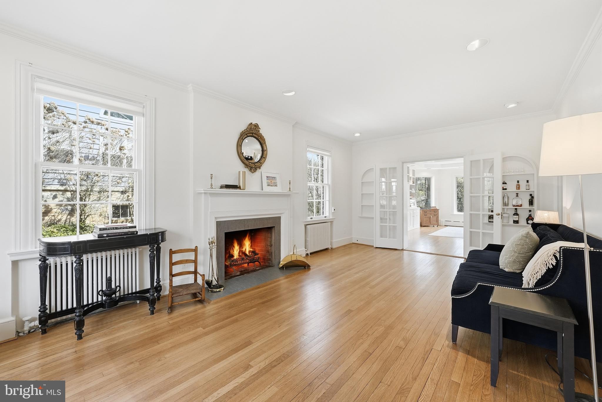 4938 Quebec Street Northwest Washington, DC 20016 - Photo 6 of 51 a living room with furniture and a fireplace