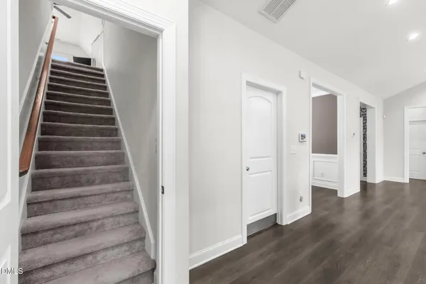 a view of an entryway with wooden floor