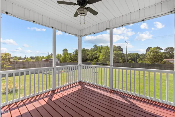 a view of balcony with wooden floor