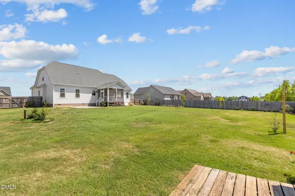 a view of house with outdoor space and swimming pool