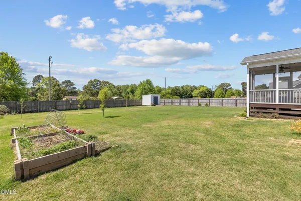 a view of a garden and basketball court