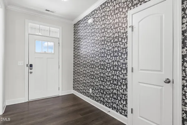 a view of a black door and an empty room