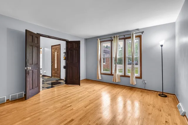 a view of an empty room with glass door