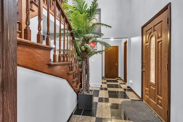 a vase of flowers sitting on a table in front of a window