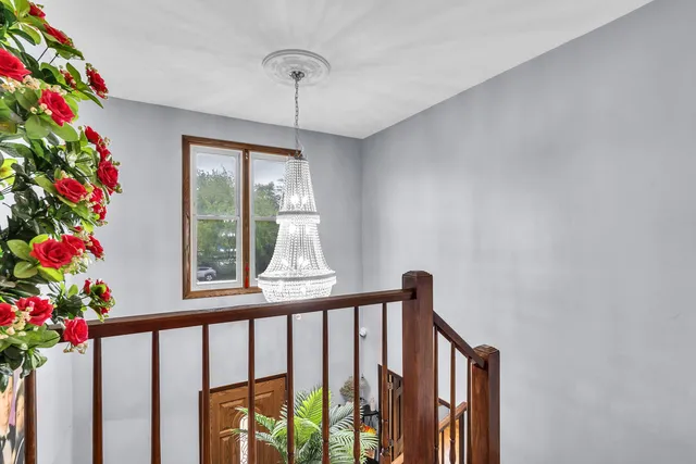 a bed room with a bed and a television