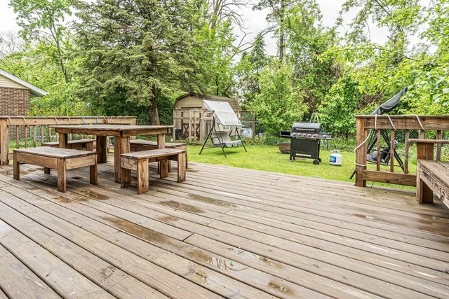 a view of a house with a yard and sitting area