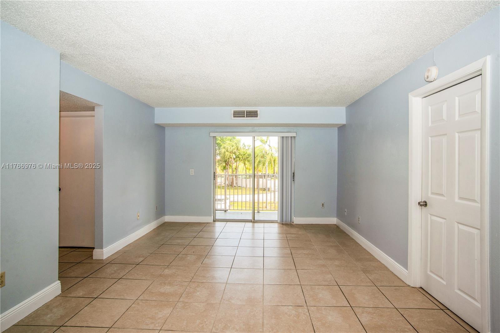 8200 Southwest 210th Street, Unit 111 Cutler Bay, FL 33189 - Photo 15 of 23 a view of an empty room with window