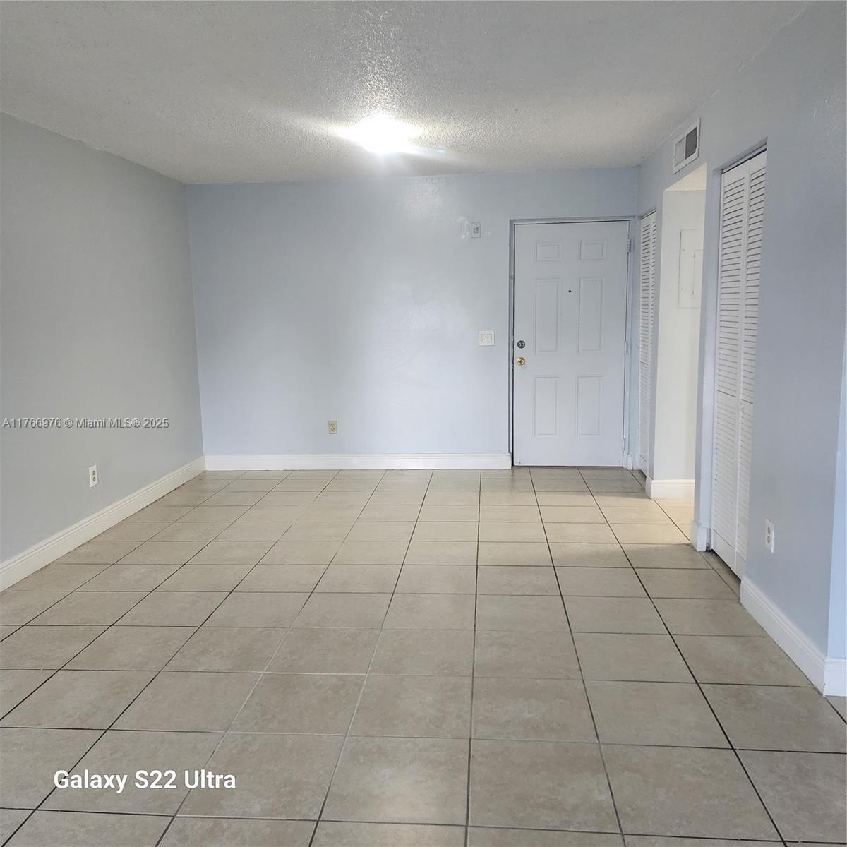 8200 Southwest 210th Street, Unit 111 Cutler Bay, FL 33189 - Photo 4 of 23 a view of an empty room