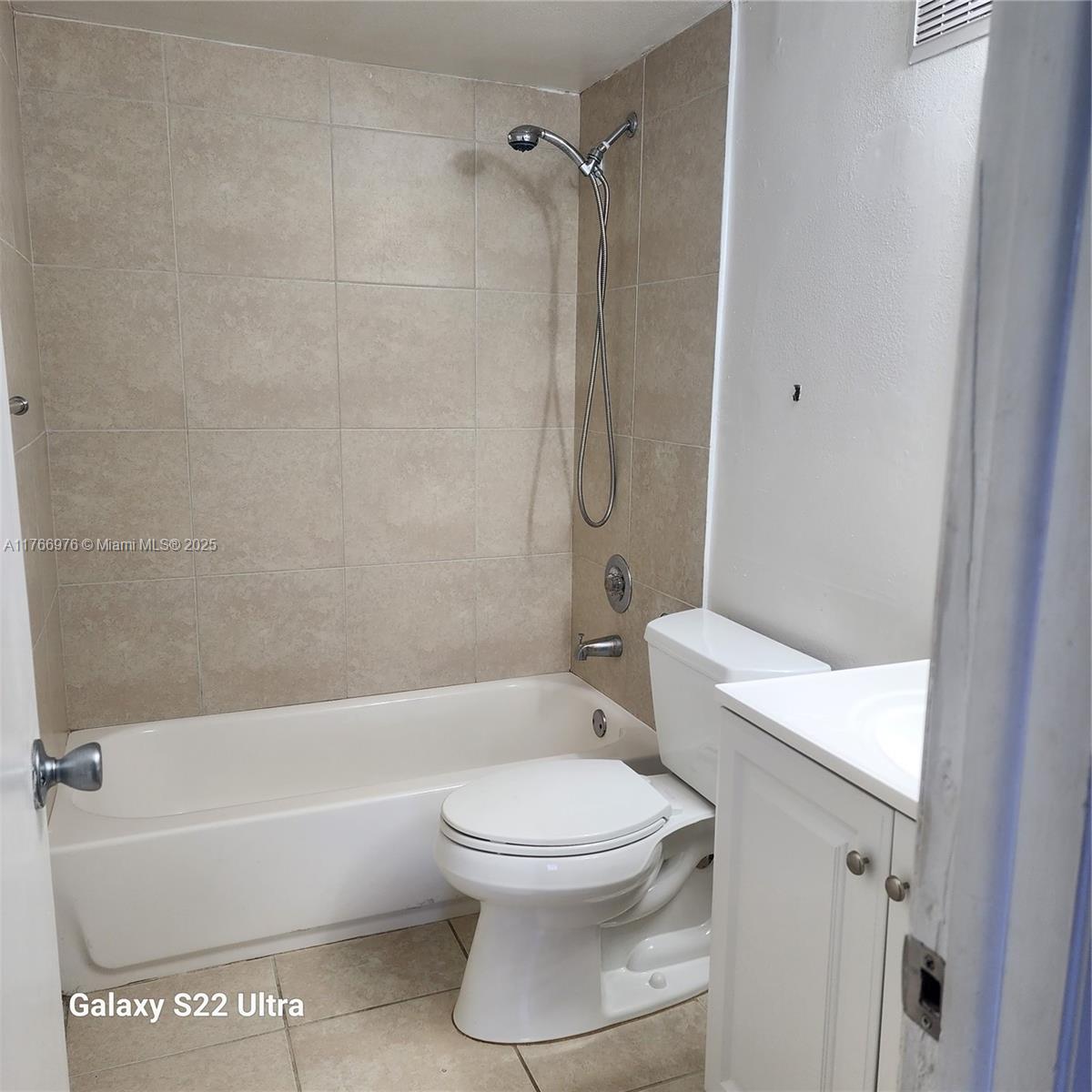 8200 Southwest 210th Street, Unit 111 Cutler Bay, FL 33189 - Photo 6 of 23 a bathroom with a toilet and a bathtub
