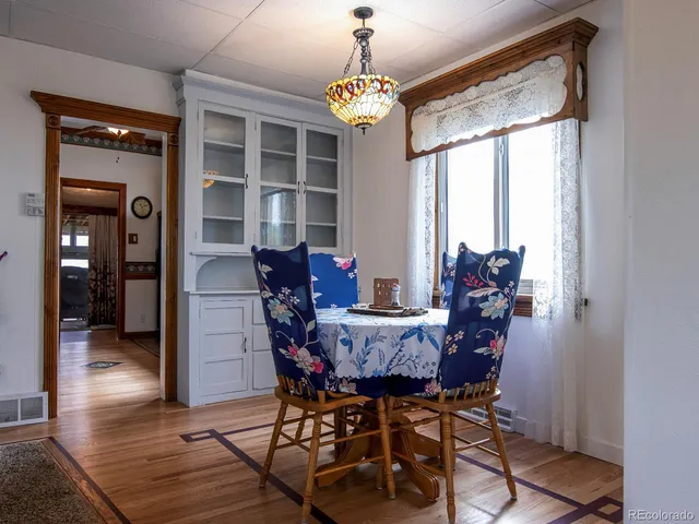 a view of a walk in closet with clothes and shoes