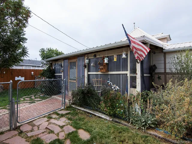 a view of a dining room with furniture and window