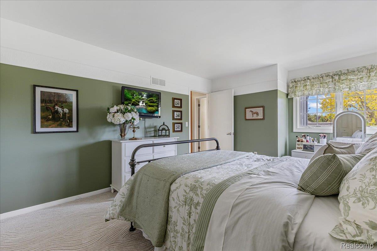 69075 Brookhill Drive Romeo, MI 48065 - Photo 20 of 28 Spacious room featuring a carpeted floor, painted walls, and a window with natural light