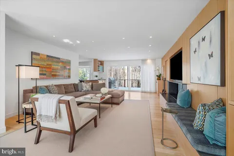 a large living room with stainless steel appliances granite countertop a couch and a view of living room