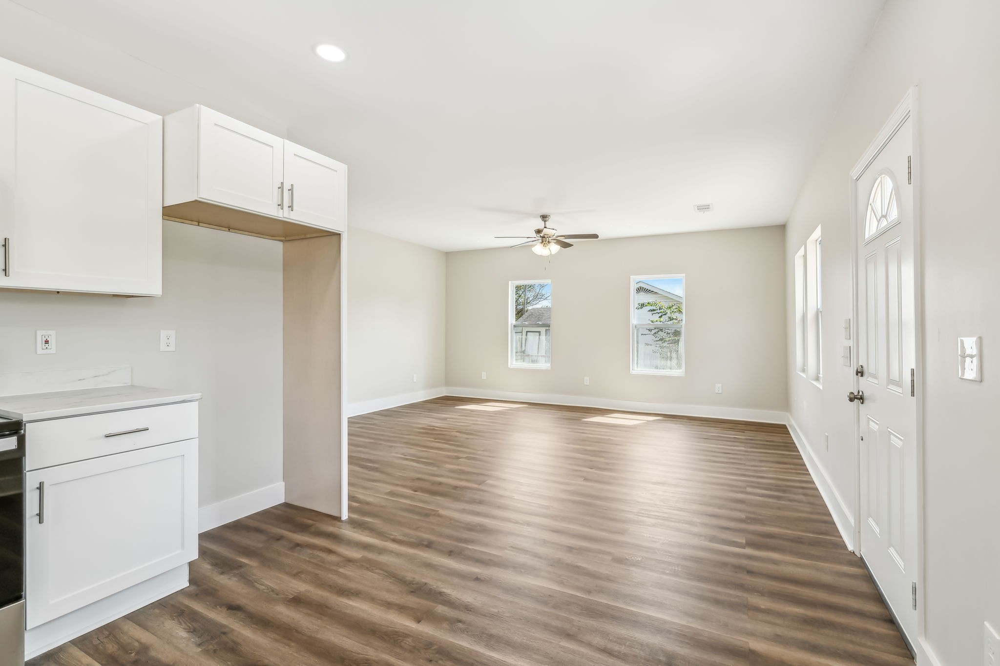 2801 Hunters Point Pike Lebanon, TN 37087 - Photo 6 of 23 an empty room with wooden floor and windows