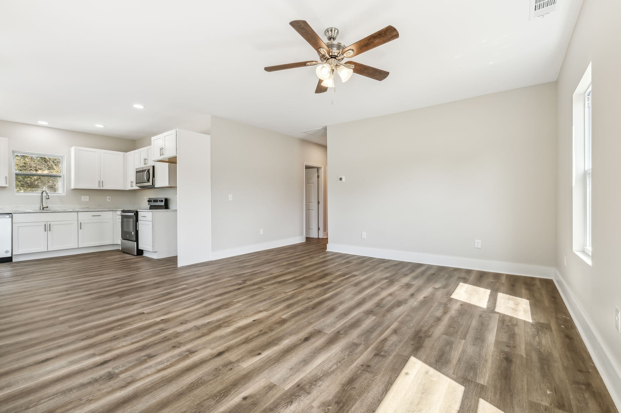 2801 Hunters Point Pike Lebanon, TN 37087 - Photo 8 of 23 a view of a kitchen with a dishwasher cabinets and wooden floor