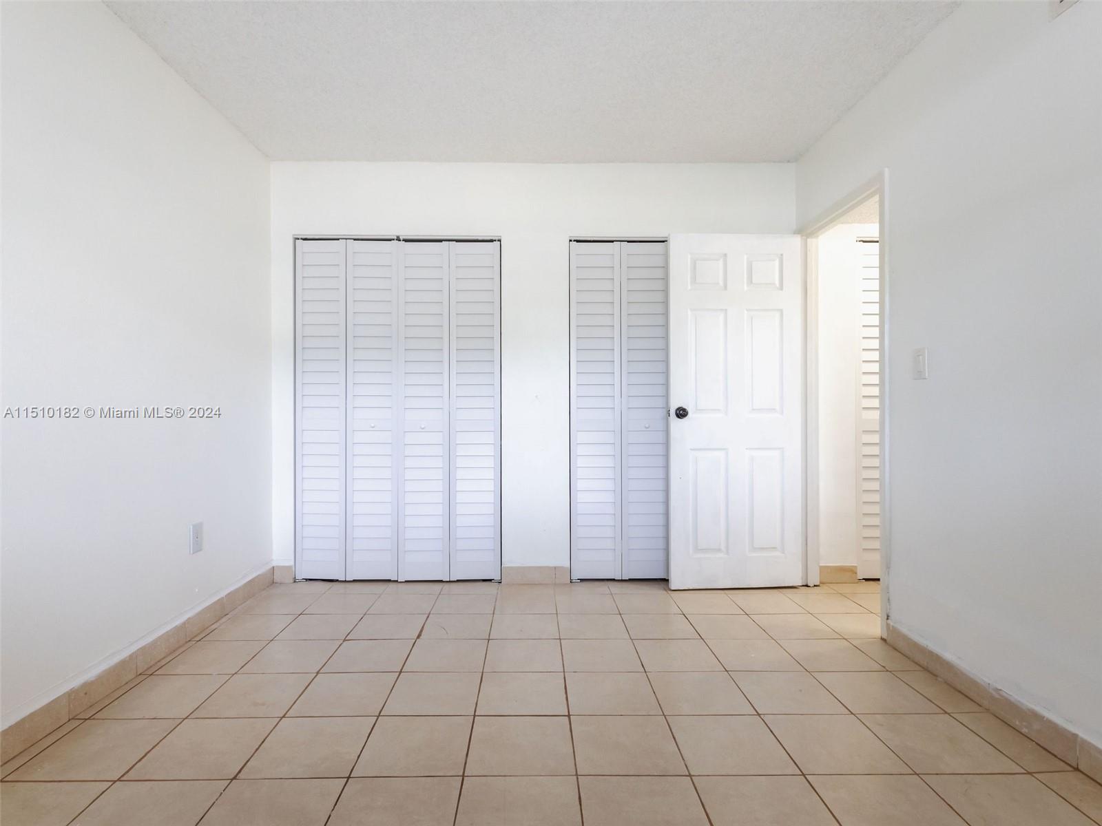 8331 Sands Point Boulevard, Unit C108 Tamarac, FL 33321 - Photo 33 of 46 an empty room with windows