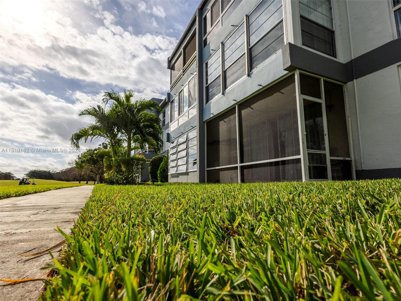 8331 Sands Point Boulevard, Unit C108 Tamarac, FL 33321 - Photo 40 of 46 a view of an entrance of the building