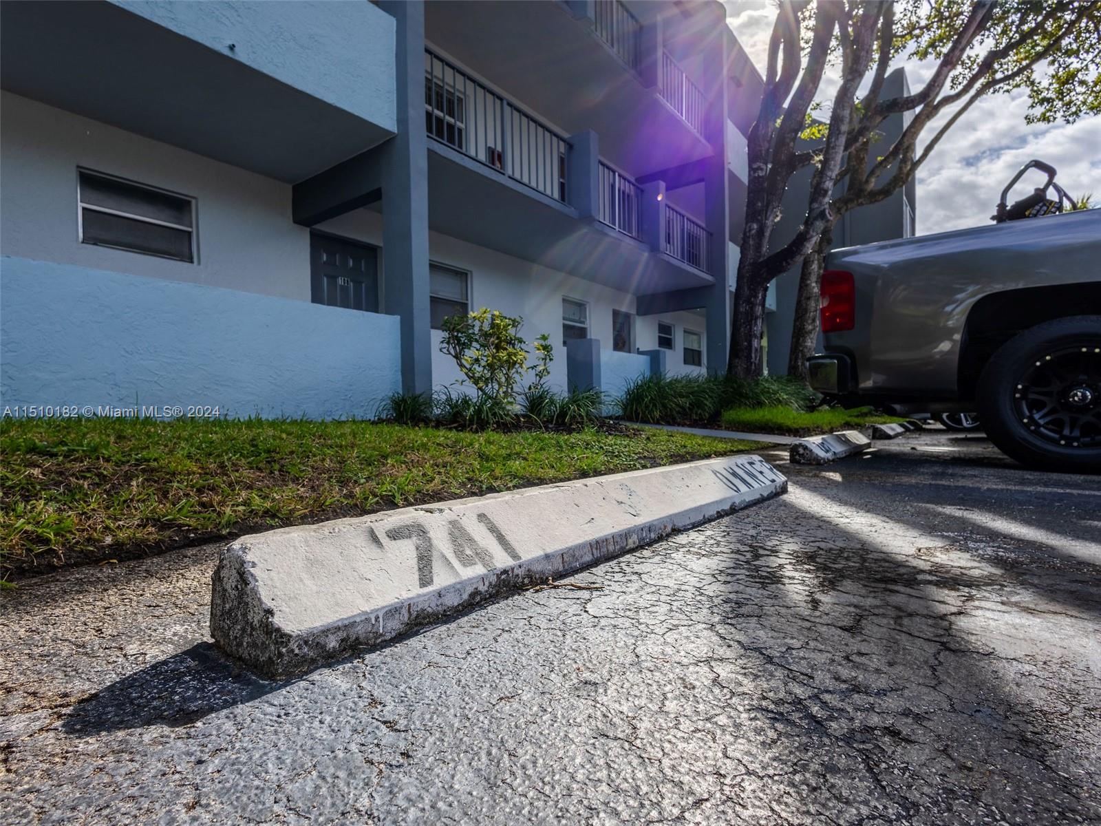 8331 Sands Point Boulevard, Unit C108 Tamarac, FL 33321 - Photo 45 of 46 a view of a house with a yard