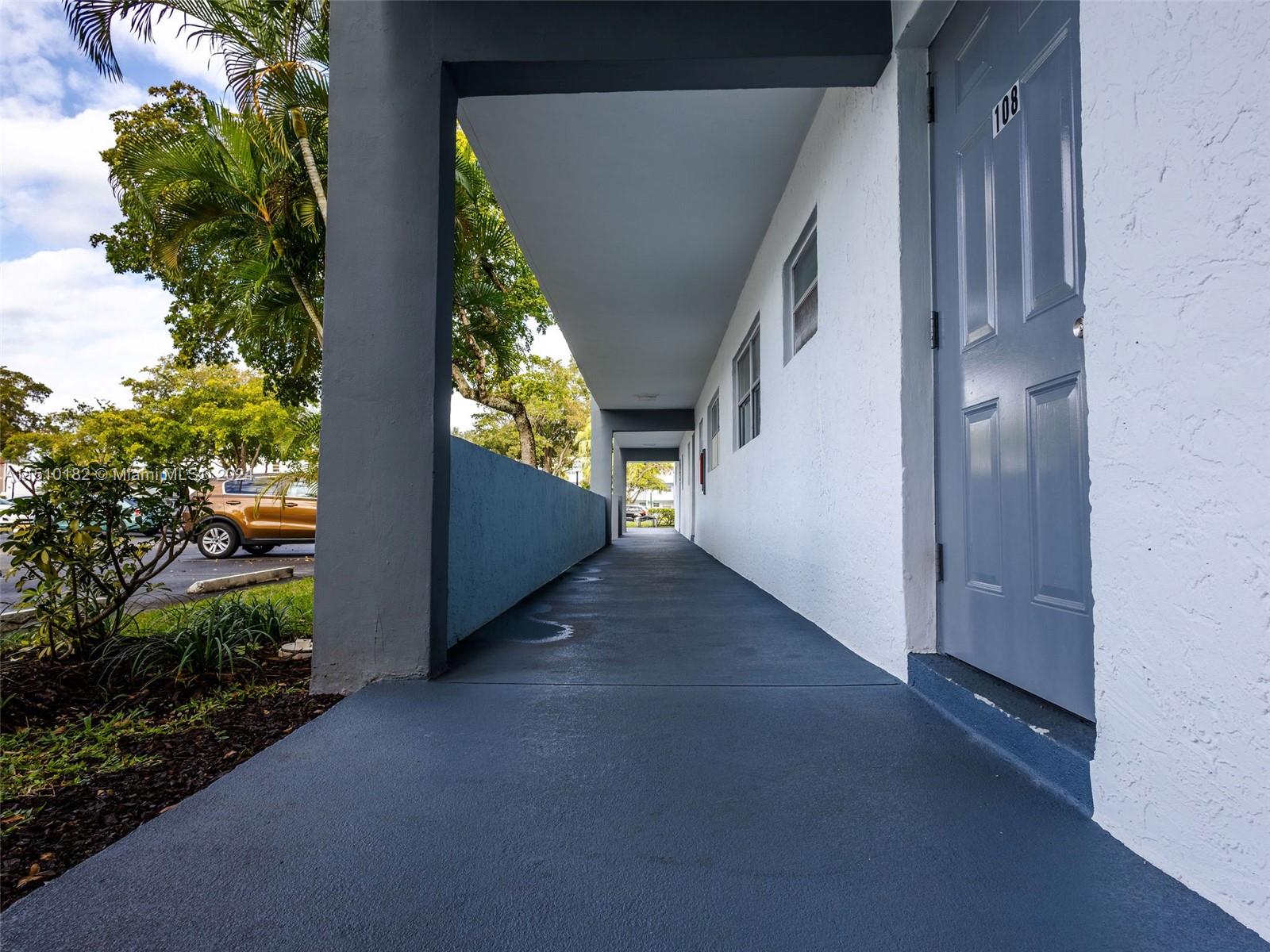 8331 Sands Point Boulevard, Unit C108 Tamarac, FL 33321 - Photo 6 of 46 a view of a porch