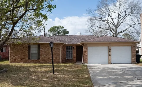 a house that has a tree in front of it