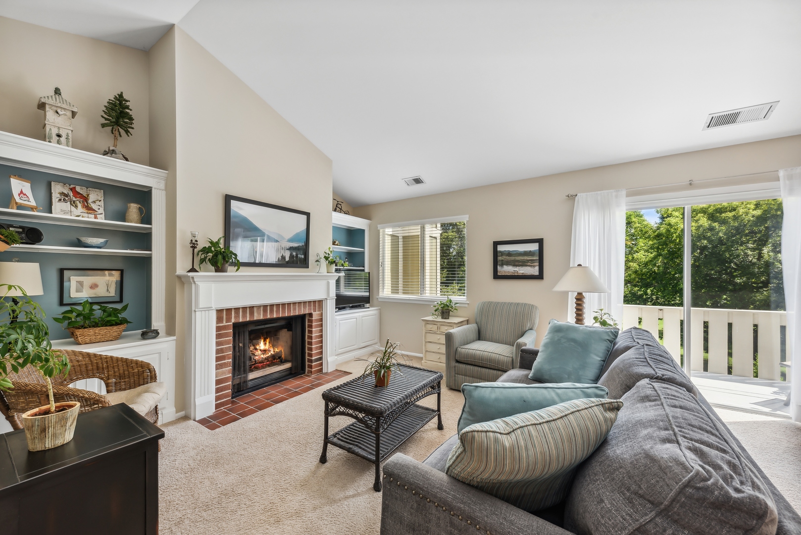 1027 Auburn Lane, Unit 1027 Buffalo Grove, IL 60089 - Photo 2 of 15 a living room with furniture and a fireplace