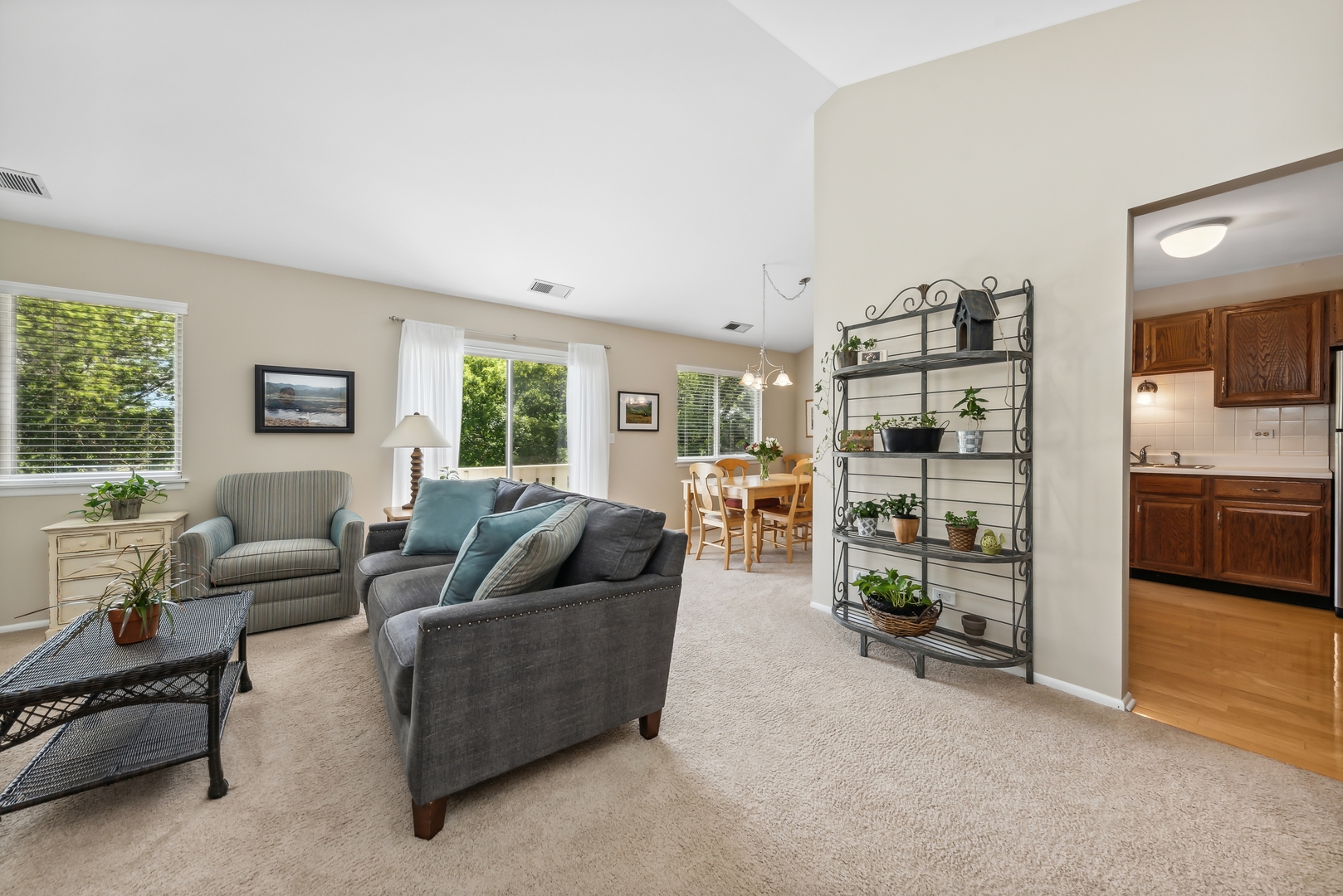 1027 Auburn Lane, Unit 1027 Buffalo Grove, IL 60089 - Photo 4 of 15 a living room with furniture and a large window