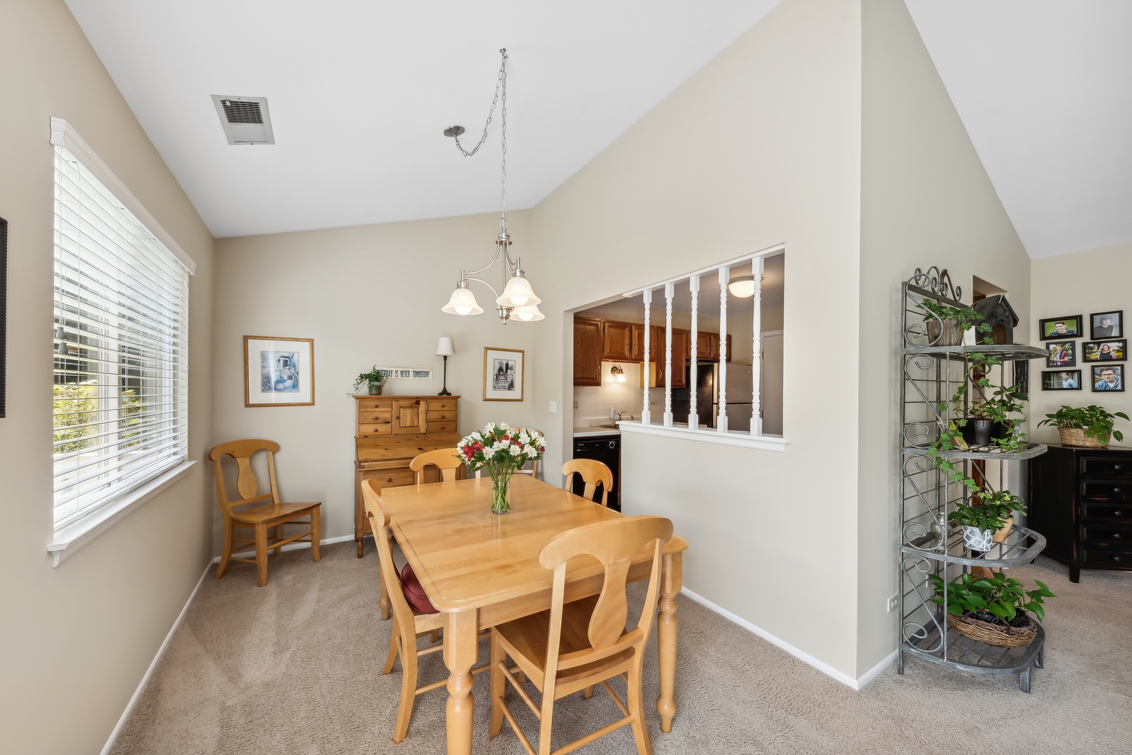 1027 Auburn Lane, Unit 1027 Buffalo Grove, IL 60089 - Photo 7 of 15 a dining room with furniture and window