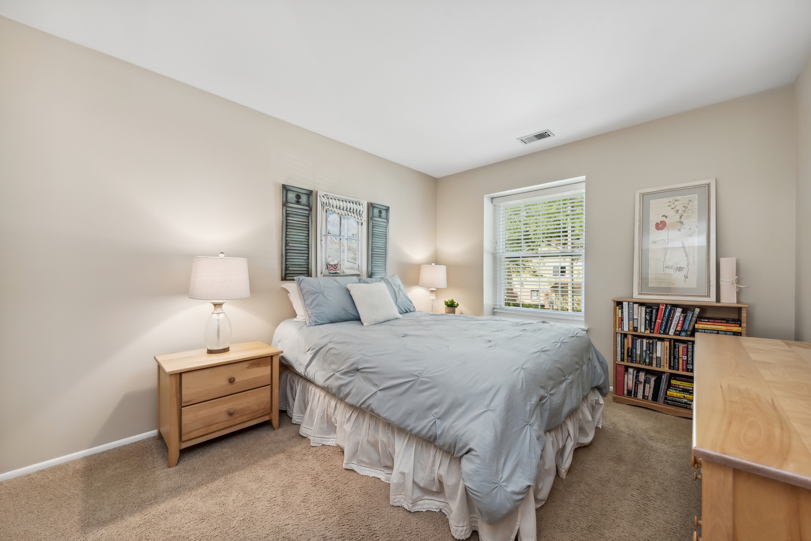 1027 Auburn Lane, Unit 1027 Buffalo Grove, IL 60089 - Photo 8 of 15 a bedroom with a bed and a table in it
