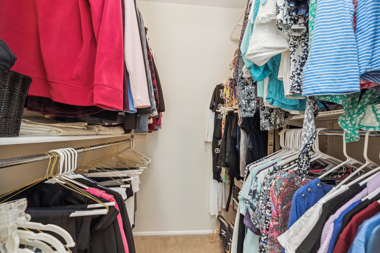 1027 Auburn Lane, Unit 1027 Buffalo Grove, IL 60089 - Photo 9 of 15 a view of walk in closet with clothes and shoes