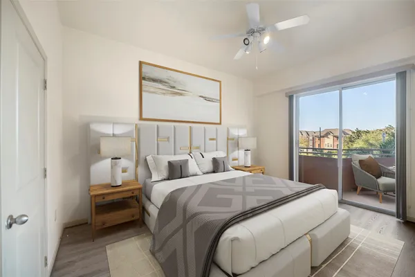 a bedroom with two beds and a chandelier