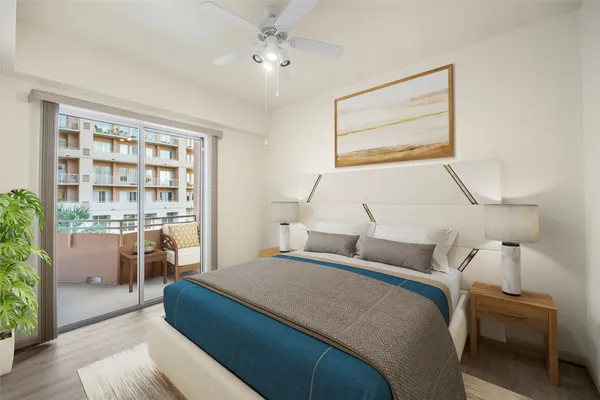 a bedroom with a large bed and a window